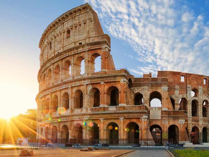 Colosseum in Rome and morning sun, Italy