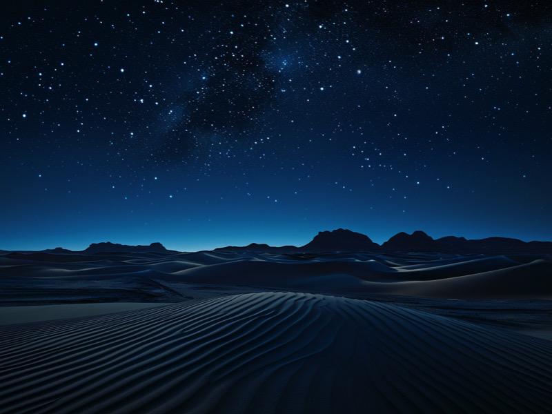 Vista nocturna del desierto de Dubái con un cielo estrellado
