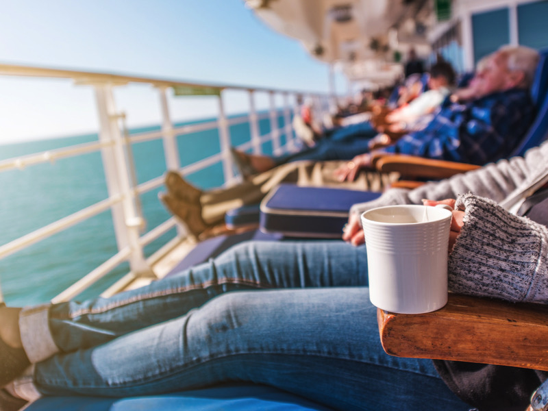 Deckchairs Cruise Ship Relax. Cruise Guest Relaxing in the Sun. Commercial Maritime Theme.